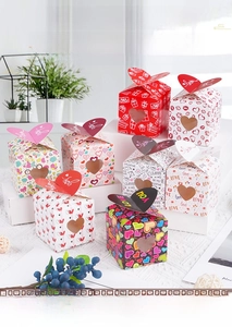 Close-up of heart-shaped folding gift boxes with clear windows for Valentine's Day
