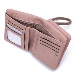 Pink PU leather wallet detail showing internal card slots and photo window with wristlet
