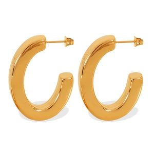 Minimalist chunky C-shaped golden hoop earrings with a polished 18k gold mirror finish