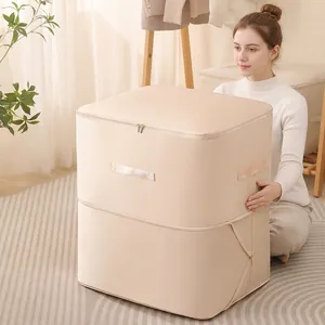 Large cream satin storage bag with handles for bedding and clothes organization