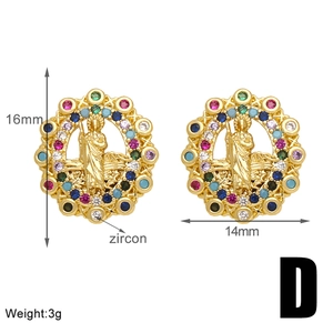 Detail view of gold coin earrings with colorful zircons and religious saint embossed pattern
