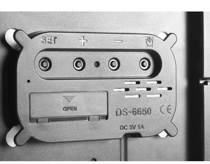 Macro detail of multi-functional LED clock back with control buttons and DC 5V power input