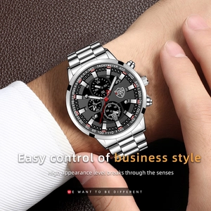 Silver stainless steel chronograph watch with black dial and date display on male wrist