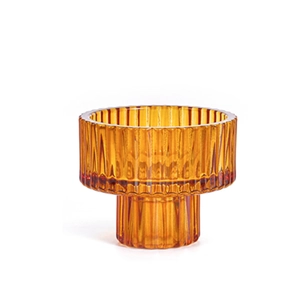 European minimalist amber ribbed glass candle holder with elegant pedestal base and decor