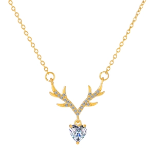 Macro detail of gold elk necklace with heart crystal and micro-pave deer antlers