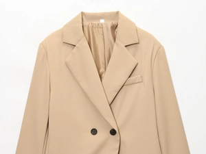Detail of khaki slim fit blazer lapel and fine fabric texture on white background