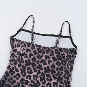 Close-up of leopard print top featuring black lace trim and adjustable spaghetti straps