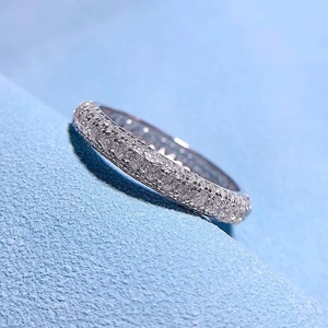 Macro side view of S925 silver ring featuring full pave cubic zirconia on blue velvet