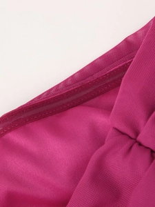 Detail of rose red mesh dress featuring inner non-slip silicone strip for secure fit