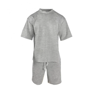 Detail of grey waffle knit fabric texture on men's t-shirt and drawstring shorts set