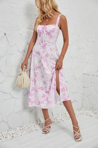 Detail of white floral sundress with sweetheart neckline and thigh-high side slit