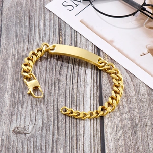 Detail of a gold stainless steel Cuban chain bracelet with a blank engravable rectangle bar