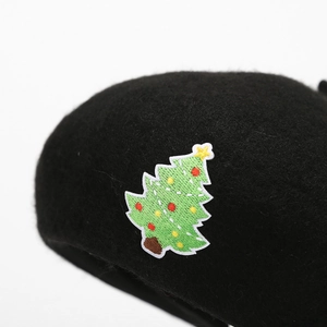 Classic black wool beret for women featuring a detailed Christmas tree embroidery