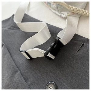 Detail of white nylon shoulder strap with black plastic buckle for women crossbody bag