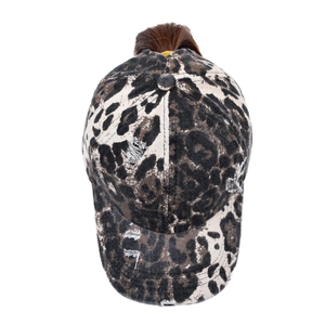 Close-up of leopard print ponytail baseball cap with distressed details and high bun opening