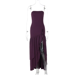 Detailed view of magenta strapless dress featuring ruffled accents and a high side slit