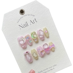 Handmade mocha pink press-on nails with 3D resin hearts, stars and butterfly charms