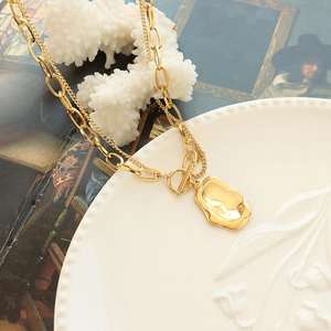 Double-layered gold titanium steel necklace with irregular pendant and T-bar toggle clasp