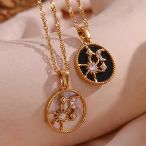 Celestial sun moon pendant necklace in 18K gold plated steel with shell and enamel