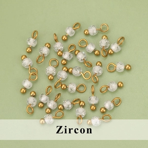 DIY jewelry parts featuring faceted clear zircon beads and golden stainless steel ball pins