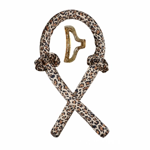 Detail view of leopard print heatless hair curler set with a golden claw clip