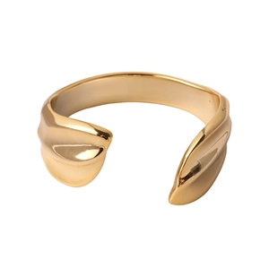 Minimalist irregular geometric open gold bangle with polished reflective organic surface