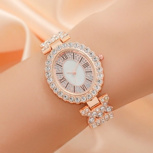 Elegant rose gold oval watch for women with rhinestones and Roman numerals on soft fabric
