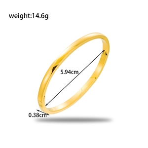 Polished gold stainless steel oval bangle with 5.94cm inner diameter and minimalist design
