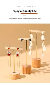 Three-piece gold metal T-bar earring display stands with natural cylindrical wooden bases