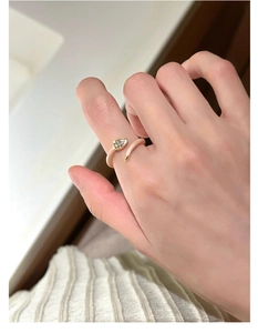 Detailed shot of s925 silver ring featuring pink enamel finish and teardrop zircon gemstone