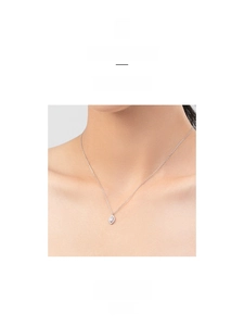 Close-up of S925 silver necklace with marquise-cut eye pendant worn on a model