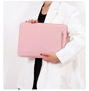 Pink laptop sleeve with zipper and side pocket held by a model on white background
