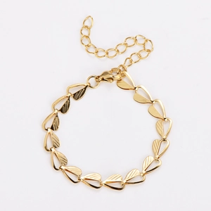 Close-up of gold-plated leaf links with textured finish and lobster clasp on bracelet