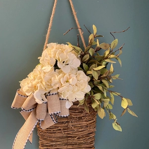 Handcrafted door basket wreath with white hydrangeas and rustic burlap bow decor