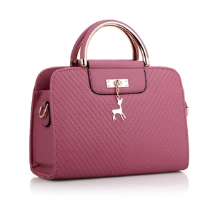 Deep pink embossed women's handbag with V-stitch pattern and golden deer pendant detail