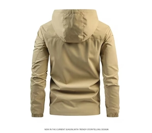 Rear view of khaki hooded windbreaker showing back panel stitching and elastic cuffs