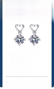 Detail of s925 silver heart stud earrings featuring 1 carat moissanite with platinum finish