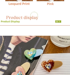 Detail of candy-colored acetate heart hair clips with sparkling rhinestones in various colors