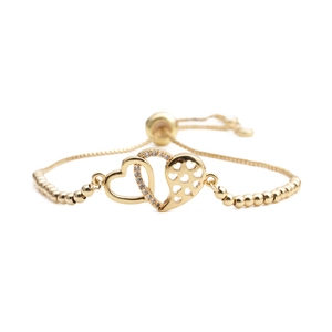 Adjustable gold double heart bracelet with cubic zirconia and minimalist chain design