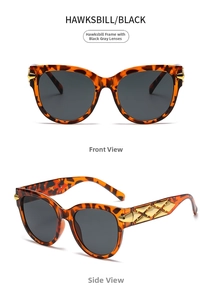 Detail of tortoiseshell sunglasses with metal quilted temples and dark gray lenses