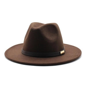 Detail of dark brown wool fedora with black decorative band and golden metal buckle