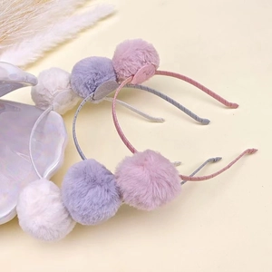 Cute faux fur ball headbands for children in pink, gray, and cream with plush cat ears
