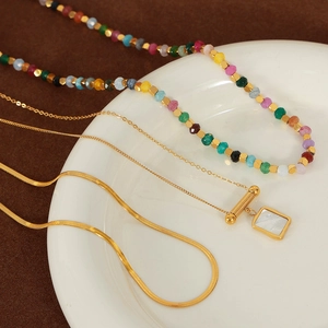 Layered gold necklaces with square mother of pearl pendant and colorful beaded chain set