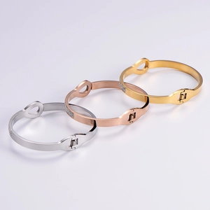 Set of three infinity bracelets in gold, silver, and rose gold with micro-inlaid diamonds