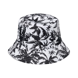 Close-up of tropical palm tree prints and stitching details on the bucket hat