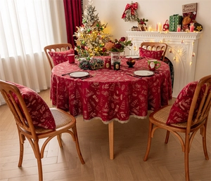 Detail of red Christmas tablecloth with reindeer jacquard and festive holiday patterns