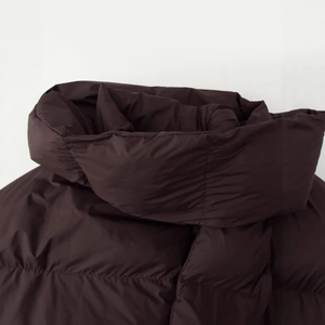 Deep chocolate puffer jacket featuring a thick padded collar and detachable scarf details