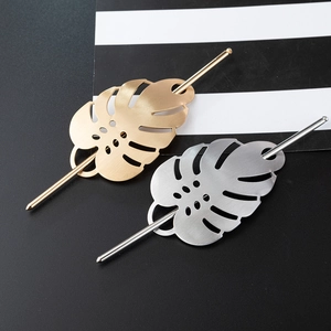 Elegant gold and silver monstera leaf metal hair pins for women with brushed finish