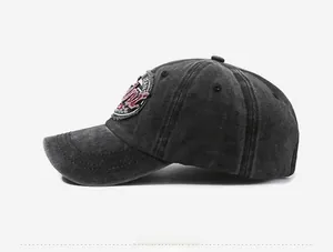 Side view of dark gray washed cotton baseball cap with vintage embroidery and worn effect