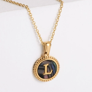 Gold round embossed necklace with letter L and dark iridescent shell pendant for women